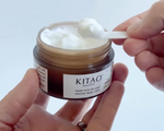 Kitao Matcha Facial Cream opened container showing texture with spatula